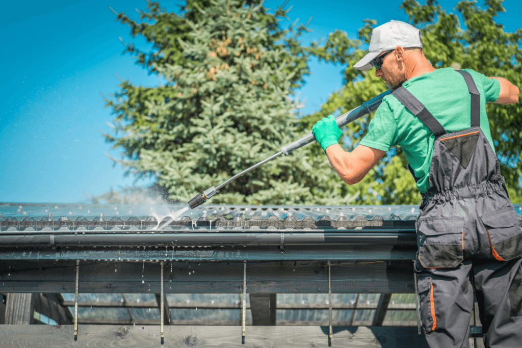 cleaning gutters with pressure