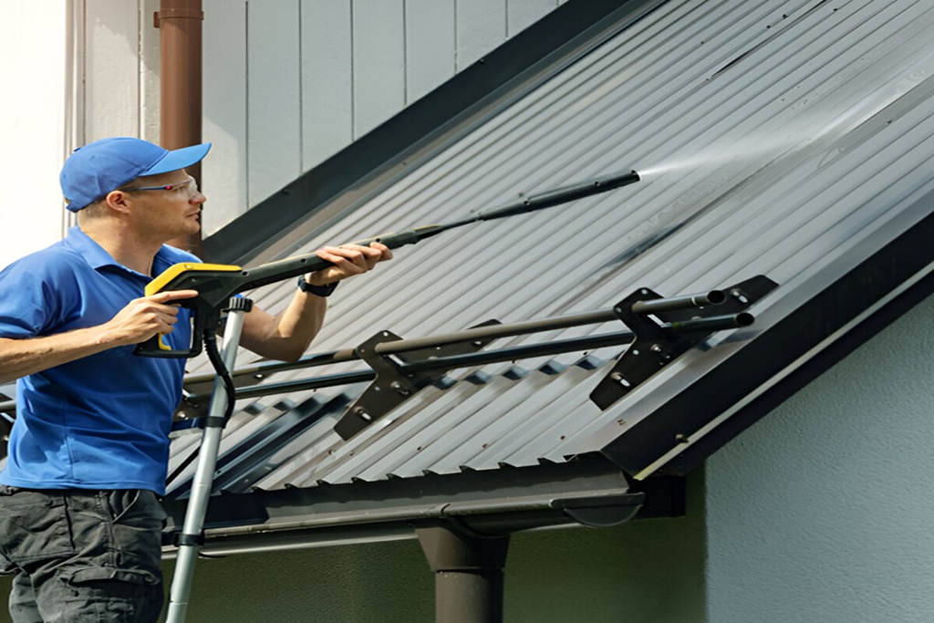 Pressure washing of the roof and gutters